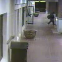 <p>A robbery suspect leaves Fairfield&#x27;s Lenox Jewelers after a kidnapping and robbery on April 11.</p>