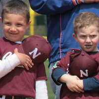 <p>A couple of young ballplayers cover their hearts for the Pledge of Allegiance. </p>