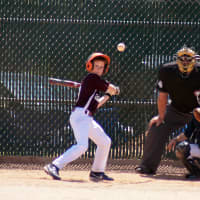<p>Sean Ward of Schwatz Law swings at a pitch as catcher Ryan D&#x27;Amico of Terzian Trucking watches. </p>