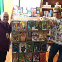 <p>Jim Crocker, manager of Modern Myths in Mamaroneck, preps for Free Comic Book Day Saturday.</p>