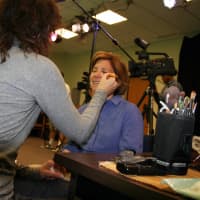 <p>North Salem resident and make-up artist Suzanne Sandbank applies make-up to Pam Pooley.</p>