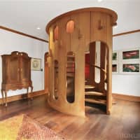 <p>The spiral staircase is enclosed in a wooden cylinder.</p>
