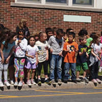 <p>Students at S.J. Preston Elementary School in Harrison cheer on Ty Powers as he finishes up the Boston Marathon.</p>