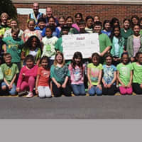 <p>Ty Powers and members of the Green Key Service Club at S.J. Preston Elementary School in Harrison.</p>