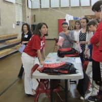 <p>Rye Middle School students learn about various types of families at one of the booths set up for the Diversity Expo.</p>