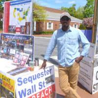 <p>Frank Mathis, a member of the LaRouche Political Action Committee, meets with people in New Canaan on Tuesday, spreading the group&#x27;s message. </p>