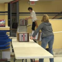<p>Larchmont Mamaroneck Hunger Task Force volunteers unload and sort donated food items.</p>