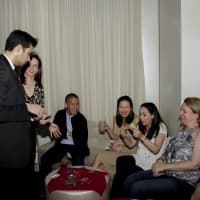 <p>Magician Dan White impresses guests at the JLCW fundraiser in White Plains.</p>