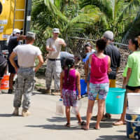 <p>Puerto Rican residents standing in line for water following Hurricane Maria last September.</p>