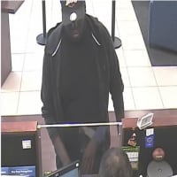 <p>Surveillance cameras captured this photo of the suspect who robbed the Chase Bank at 165 Noroton Ave. in Darien on July 11. This robbery remains under investigation.</p>
