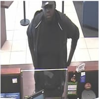 <p>Surveillance cameras captured this photo of the suspected who robbed the Chase Bank at 165 Noroton Ave. in Darien on Tuesday.</p>