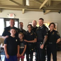 <p>Charlie and Olivia Rabin with Norwalk Police at Coffee with a Cop.</p>