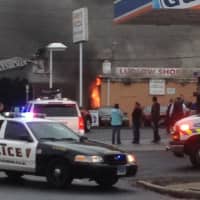 <p>Flames can be seen at the Ludlow Shopping Centre at Roger Square in East Norwalk on Thursday afternoon.</p>