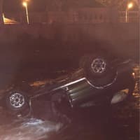 <p>First responders from the Norwalk police and fire departments rescued the driver of a car that went into the Norwalk River on March 6.</p>