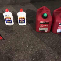 <p>The NYPD tweeted a photo of the gas cans, lighter fluid and lighters seized from Lamparello.</p>