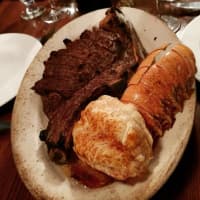 <p>Bone in ribeye and Brazilian lobster tail at Wayne Steakhouse.</p>