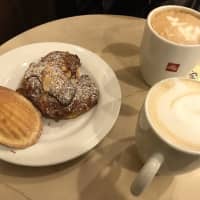 <p>Madeleine, almond croissant, latte and a cappuccino at Sook Pastry in Ridgewood.</p>