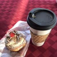 <p>Cannoli donut and coffee from Glaze Donuts in New Milford.</p>