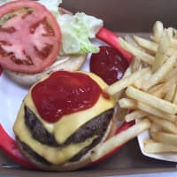 <p>Burger and fries at Red Rooster in Brewster.</p>