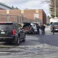 <p>Stamford police cars and personnel fill the area around Stamford High School after a bomb threat Tuesday.</p>