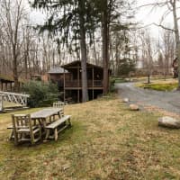 <p>The Mill House property for sale in Wilton includes a main house — a converted saw mill house — as well as a cottage and carriage house.</p>