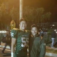 <p>Yoon, 48, and his son, 19, a starting center on the New Milford High School football team.</p>