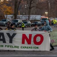 <p>Three men in a canoe were helped from the water Saturday during a protest against Spectra&#x27;s Algonquin pipeline expansion.</p>
