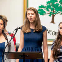 <p>Students sing during the May 30 Memorial Day tribute in Pleasantville.</p>