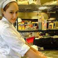 <p>The late Nikki Franco hard at work baking, a field in which she had planned to spend a lifetime.</p>