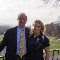 <p>Phoebe Schecter, right, talks with Ridgefield Academy&#x27;s Head of School, Jim Heus, during a recent visit. Schecter is a linebacker on the national team in Great Britain. </p>