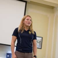 <p>Phoebe Schecter, a former Ridgefield Academy student, talks to students during a recent visit. </p>