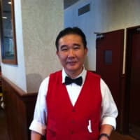 <p>Waiter Mr. Wong has been serving food at the New China Inn almost as long as the restaurant has been open.</p>