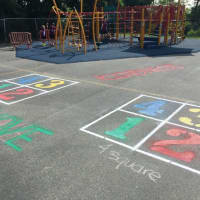 <p>The Ossining Upper Elementary School PTA worked with parent volunteers and principal Kate Mathews to paint games and a basketball court at Claremont School. </p>