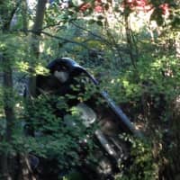 <p>The car went airborne down the embankment and was smoking at the bottom</p>