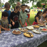 <p>Kids line up to taste pies at Saturdays Second Annual Rock &#x27;N Roots Revival Music Festival at Lonetown Farm in Redding.</p>