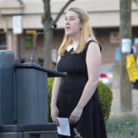 <p>Robyn Higley, who lost her father in the 9/11 terror attacks, recites the Pledge of Allegiance at the Friday ceremony in downtown Danbury. </p>