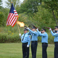 <p>Pound Ridge firefighters, perform a fusillade at a 9/11 service.</p>