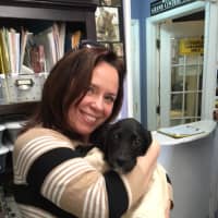 <p>Maria Russo with a puppy.</p>