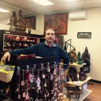 <p>Sven Sujica shows off some of the wares in his new Larchmont store, The Purple Elephants Gift Shop.</p>