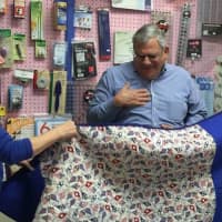 <p>Paul Ceglia, center, of Norwalk receives his quilt from State Senator Bob Duff, right, and Jane Dougherty, the Connecticut representative for Quilts of Valor.</p>