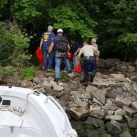 <p>Rappel team brought by Palisades Interstate Parkway Police Marine Unit head toward victim.</p>