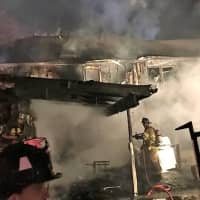 <p>Darryl Secor discovered the fire, notified authorities and tried to put it out, sustaining minor burns to his hands and his face, for which he was treated at the scene.</p>