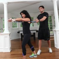 <p>Sam Langer of GYMGUYZ working with a client.</p>