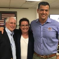 <p>Jeff Voigt, left, Bernadette Coghlan-Walsh, and Ramon Hache celebrate their victory in the race for council seats.</p>