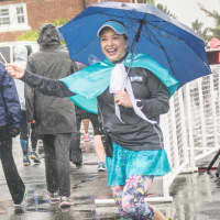 <p>&quot;Fairy Run Mother&quot; Nancy Barlow encourages runners at Sunday&#x27;s race.</p>