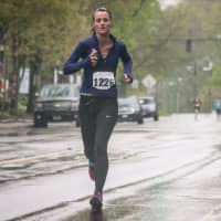 <p>Christine Garbowski of New Fairfield runs on Main Street in Ridgefield near the finish of Sunday&#x27;s Run Like A Mother 5k.</p>