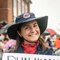 <p>Emily Lewson of Ridgefield holds a sign to encourage her mother, Anne, and other runners in Sunday&#x27;s 5k in Ridgefield.</p>