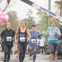 <p>Women start their journey during the 5k race at Sunday&#x27;s Run Like A Mother race in Ridgefield.</p>