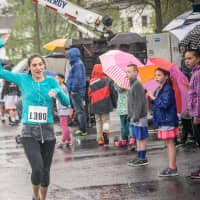 <p>Kristen Lecompte of Ridgefield hustles to a second-place finish at Sunday&#x27;s race.</p>