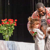 <p>First-grade students from the Winfield Morse School handed out roses to the graduating seniors of Sleepy Hollow High School during a special ceremony.</p>
